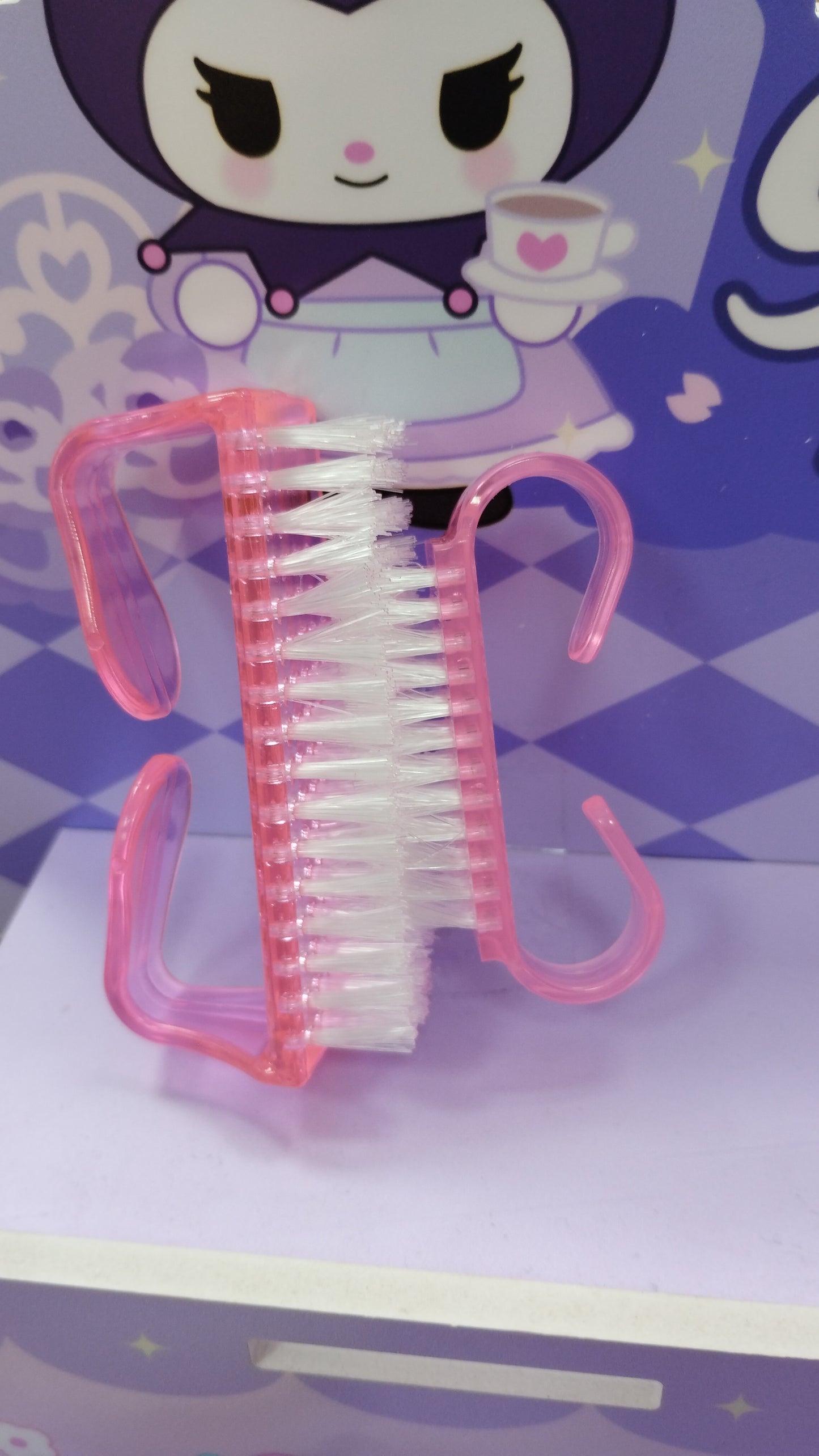 Cepilló para sacar polvo de las uñas