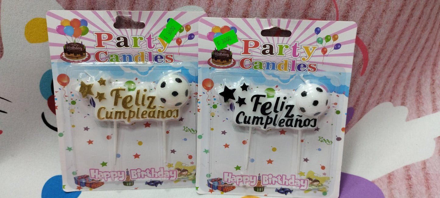 Vela con feliz cumpleaños y pelota