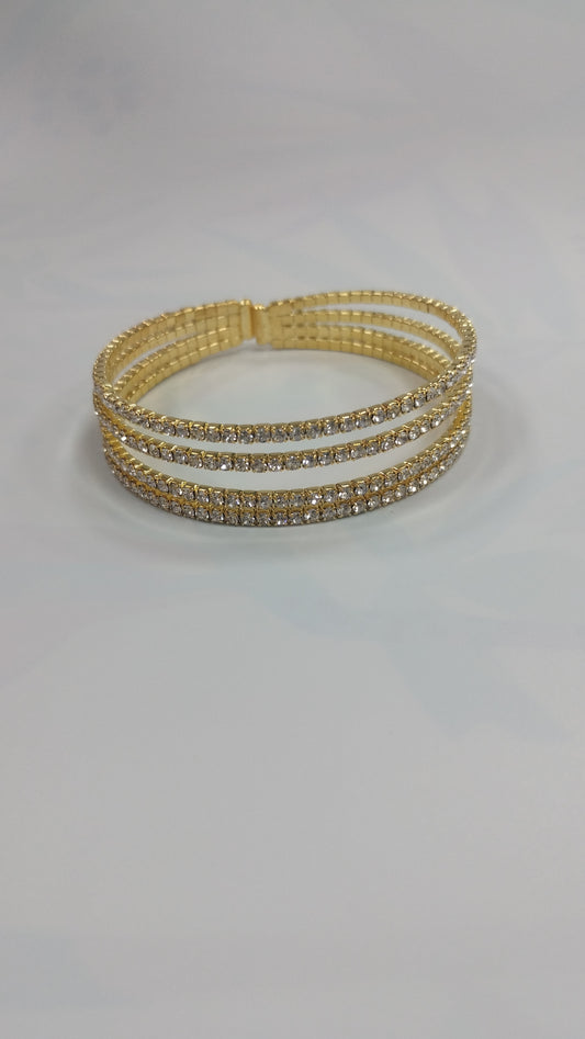Pulcera de acero dorado
