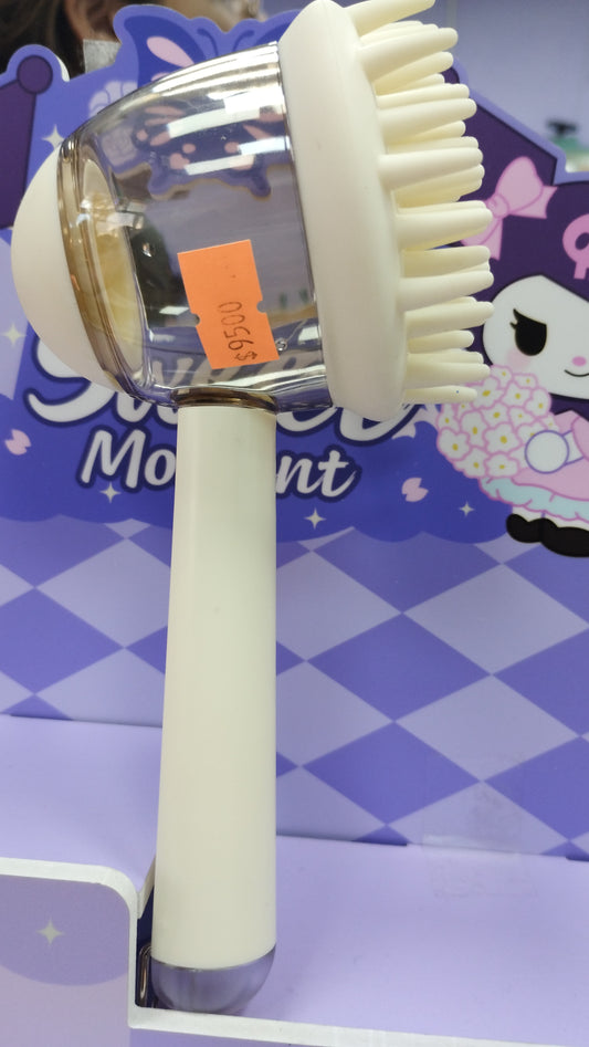 Cepillo masajeador con dispensador de shampoo