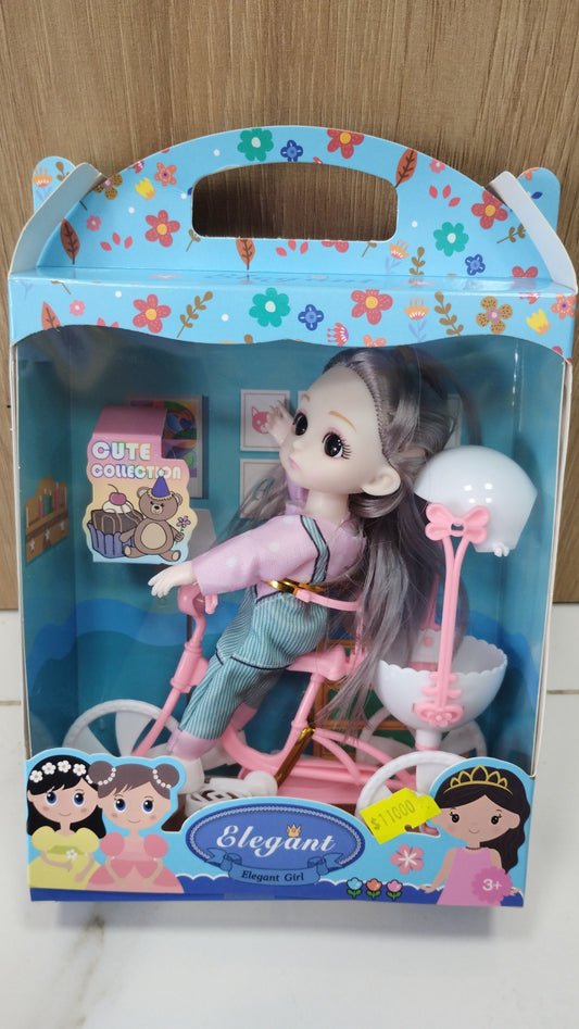 Muñeca con bicicleta