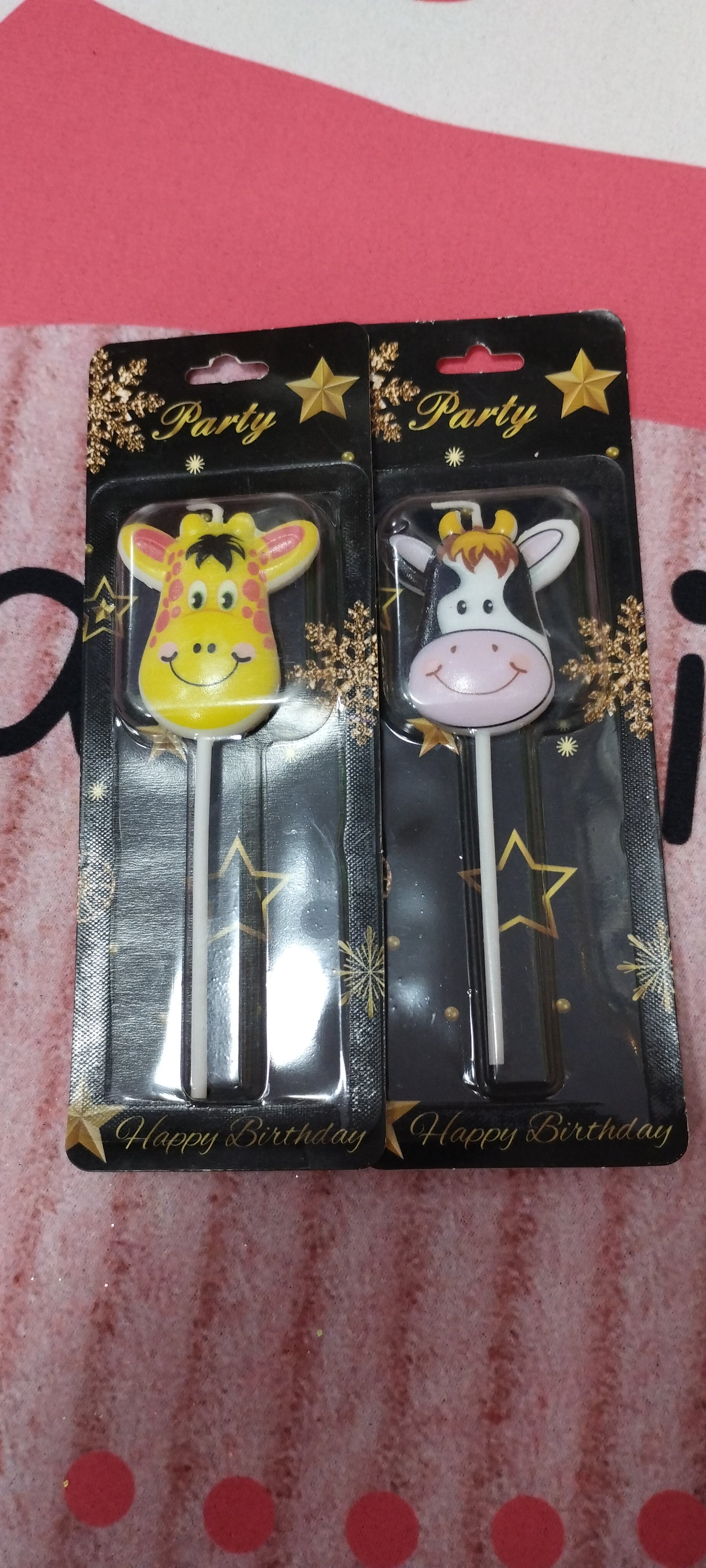 Velas de cumpleaños con forma de vaquita y jirafa