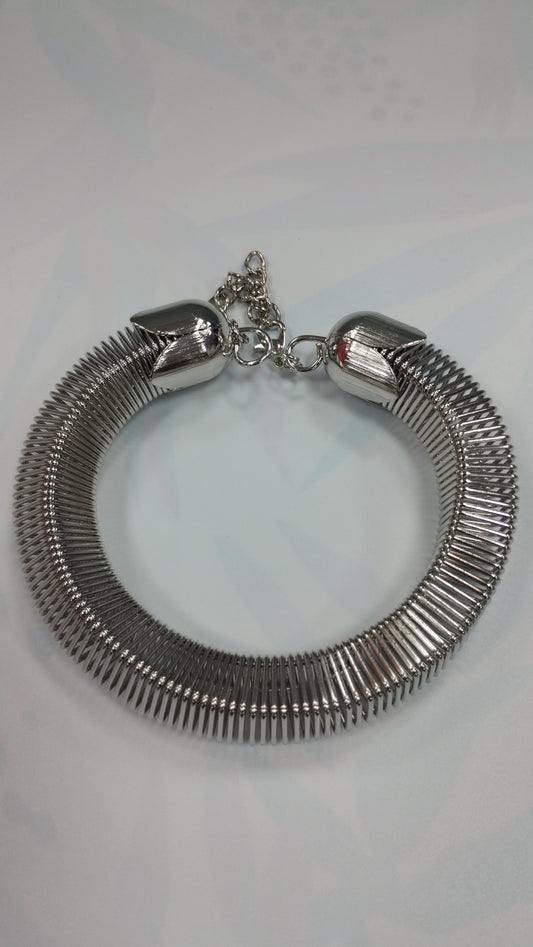 Pulcera de acero blanco y dorado