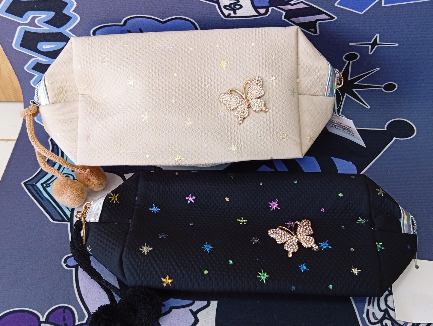Cartucheras con aplique de mariposa