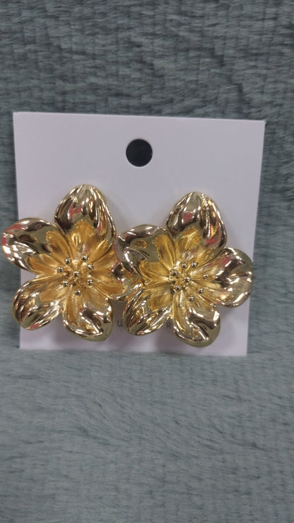 Aros de acero blanco y dorado
