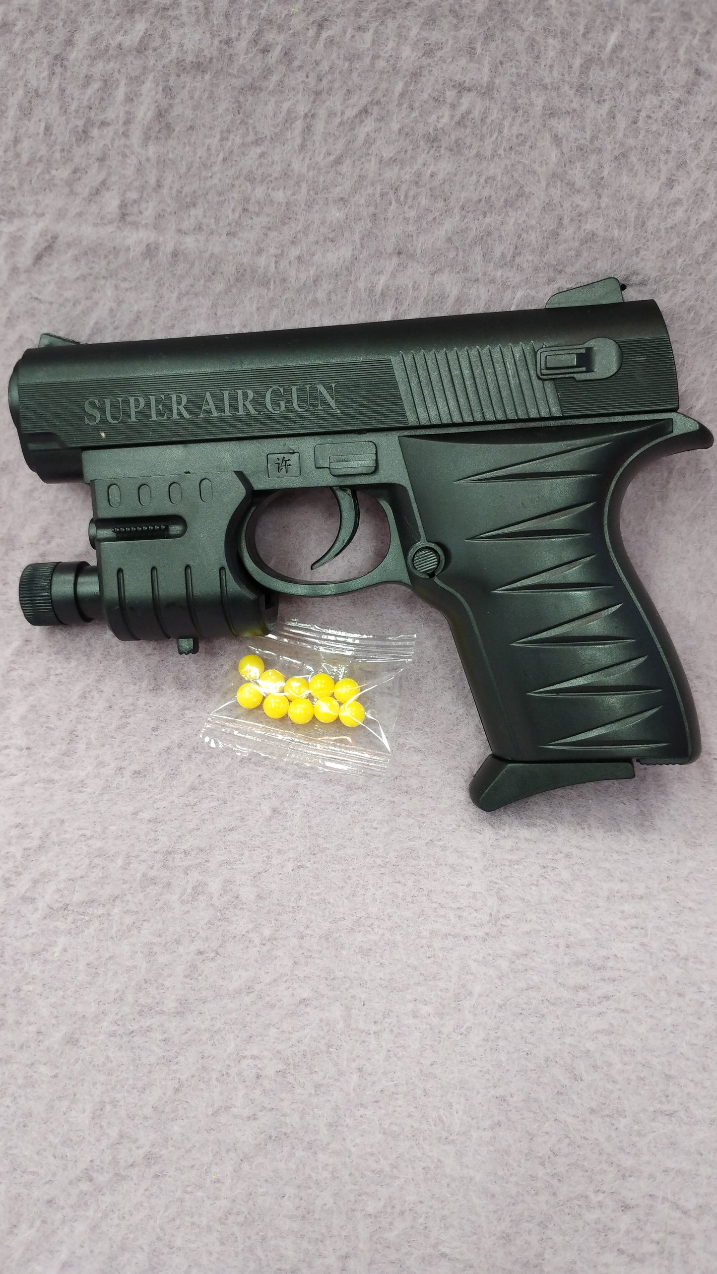 Pistola de juguete con balines