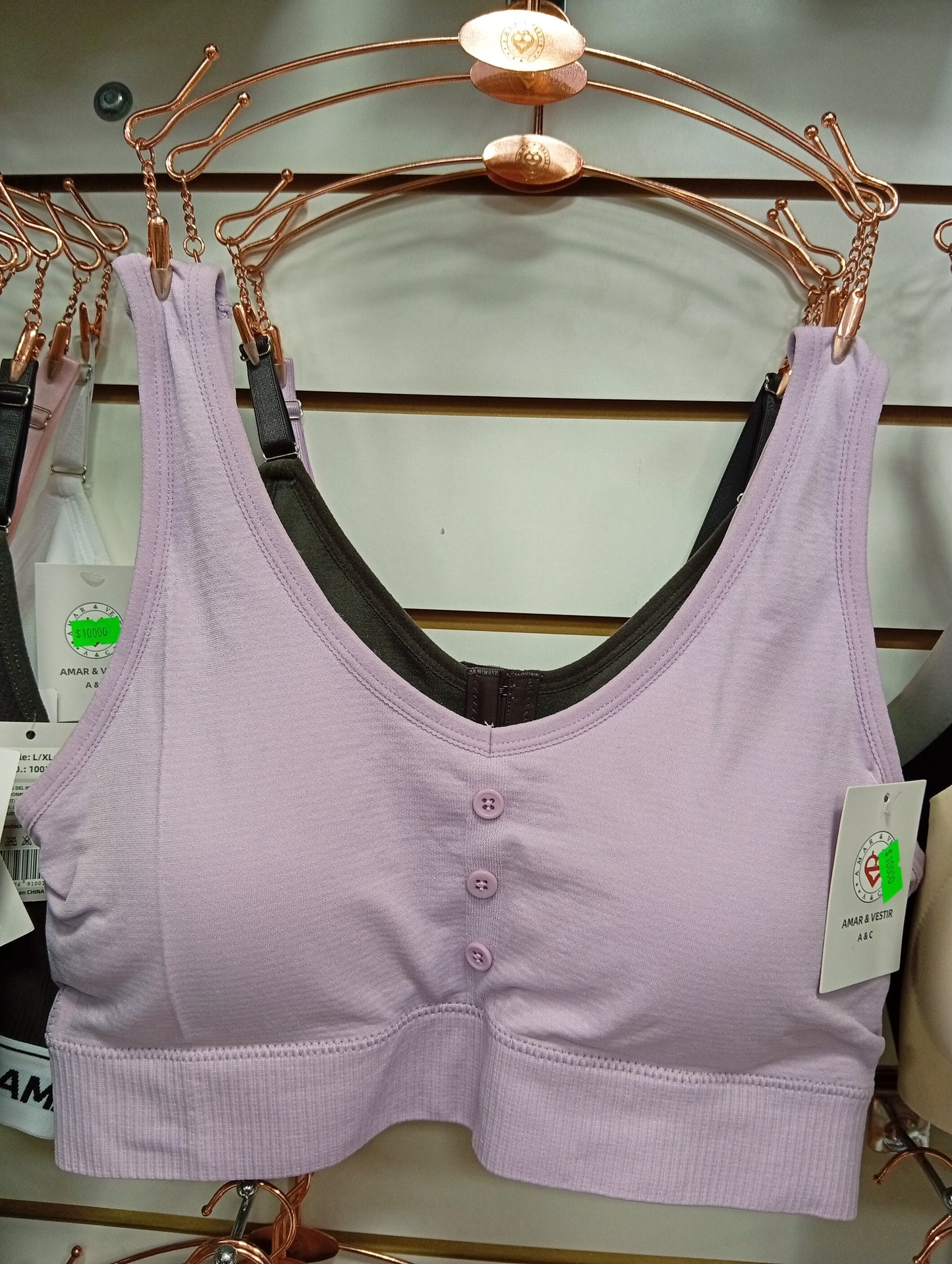 Corpiño deportivo con botones y frunce. Talle: M/L, L/XL.