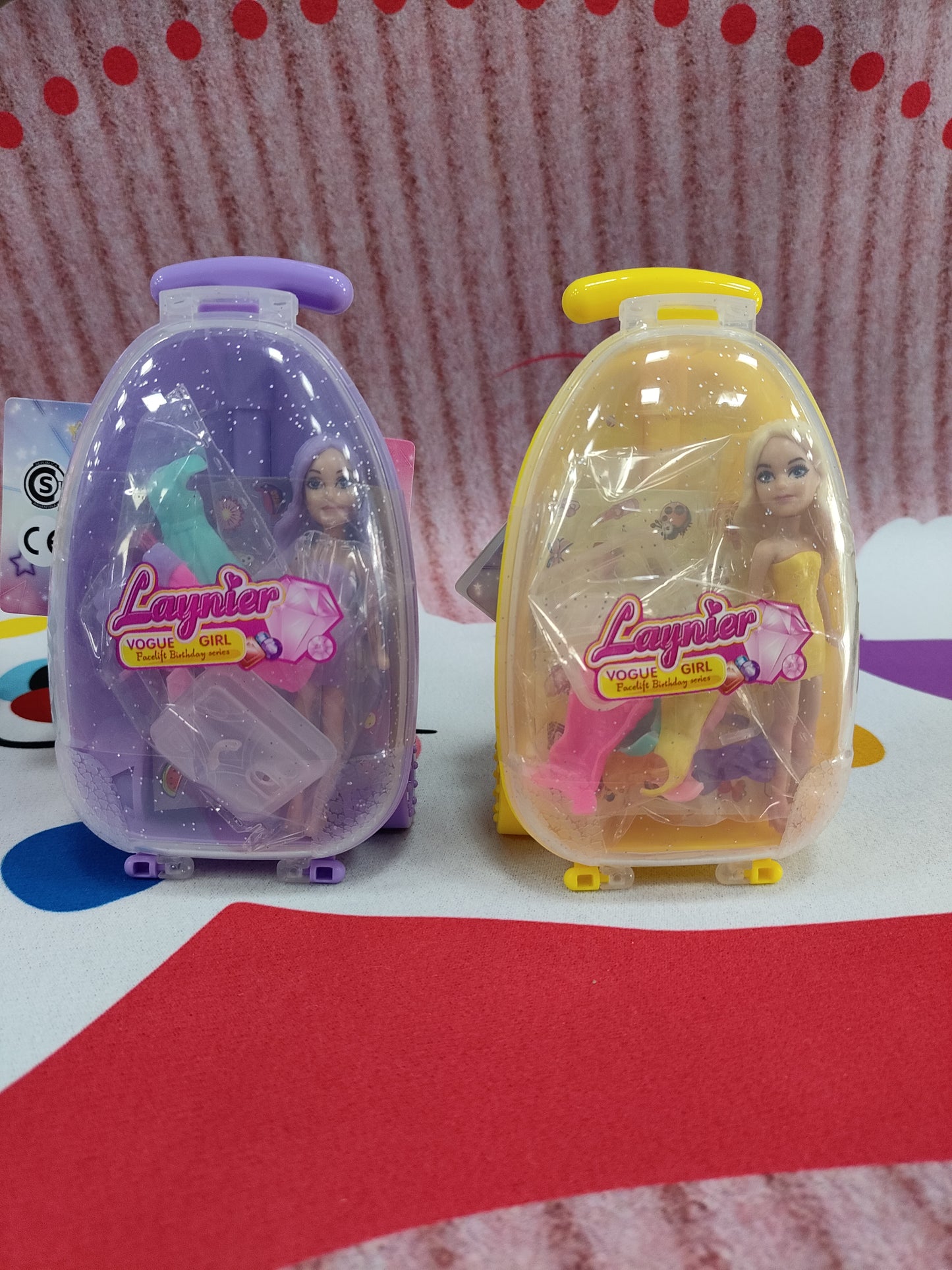Mini valija con muneca y accesorios